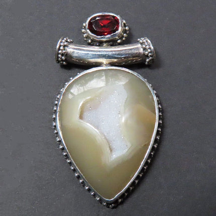 Botswana Agate & Garnet Sterling Silver Slide Pendant Jewelry on a dark background