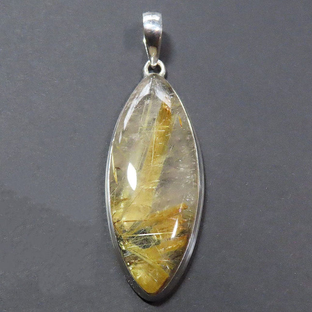 Gold Rutile in Clear Quartz Sterling Silver Pendant Jewelry on a dark gray background