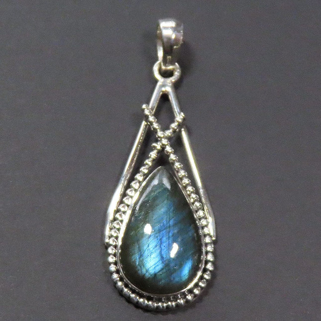 Blue Flash Labradorite Sterling Silver Pendant Jewelry on a dark background