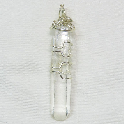 Grounding Quartz Crystal from Arkansas Wire Wrapped Pendant Jewelry on a white background