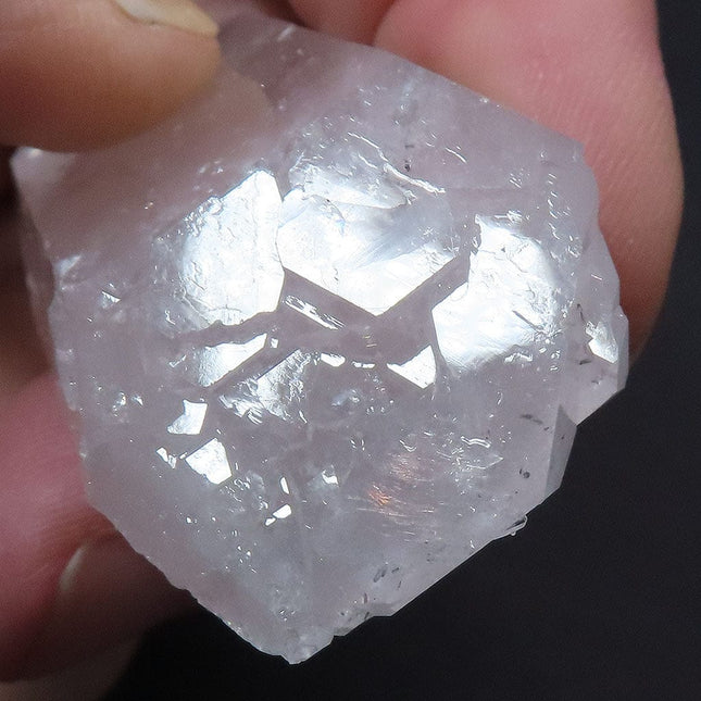Arkansas Quartz Crystal Double Terminated Tabby Point with Self-Healed Elestial Face next to a quarter for scale on a dark background
