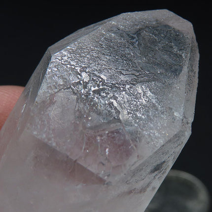 Close-up of Arkansas Quartz Crystal Point that is Etched against a dark background