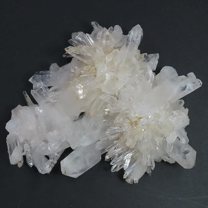 Arkansas Quartz Crystal Cluster w/ Window & Time-Link Activations and a US quarter for scale on a black background