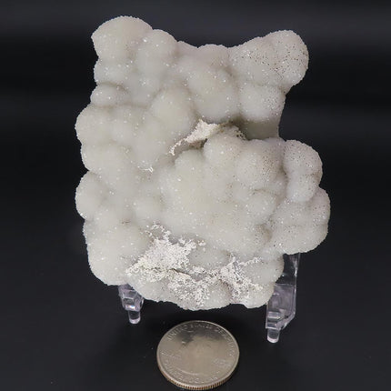 Sparkling Silver Grey Botryoidal Drusy Quartz Specimen from Missouri with a quarter for scale on a black background