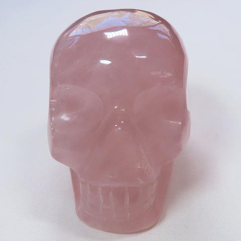 Carved Rose Quartz Crystal Skull with Rainbow from Brazil