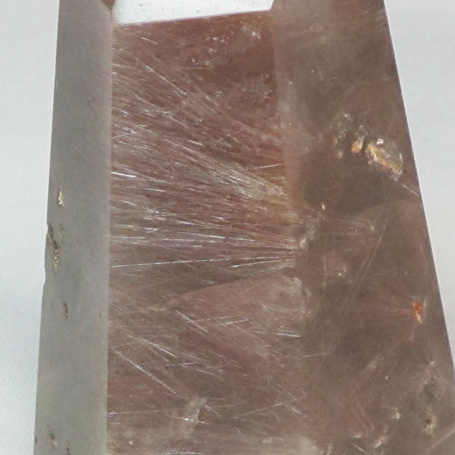 Polished Quartz Crystal Point with Rutile and Hematite Inclusions